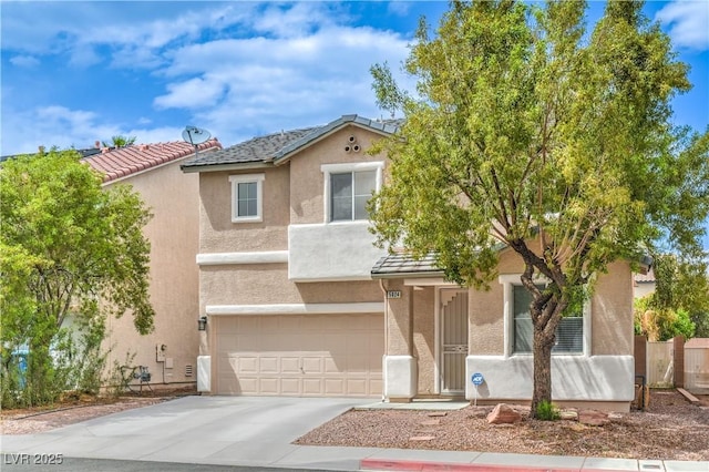 5024 Granite Creek Ct, Las Vegas, NV 89131 - view of front of home featuring an attached garage, stucco siding, driveway, and fence