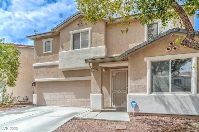 5024 Granite Creek Ct, Las Vegas, NV 89131 - view of front of house with an attached garage, stucco siding, and concrete driveway