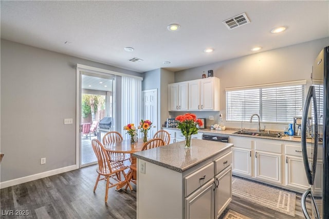 5024 Granite Creek Ct, Las Vegas, NV 89131 - kitchen featuring a sink, a center island, dark wood-style flooring, white cabinets, and recessed lighting