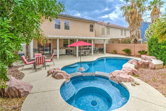 5024 Granite Creek Ct, Las Vegas, NV 89131 - view of pool featuring a pool with connected hot tub, fence, and a patio