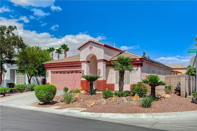 8250 Lincoln Valley St, Las Vegas, NV 89123 - mediterranean / spanish-style home featuring an attached garage, concrete driveway, stucco siding, fence, and a tiled roof