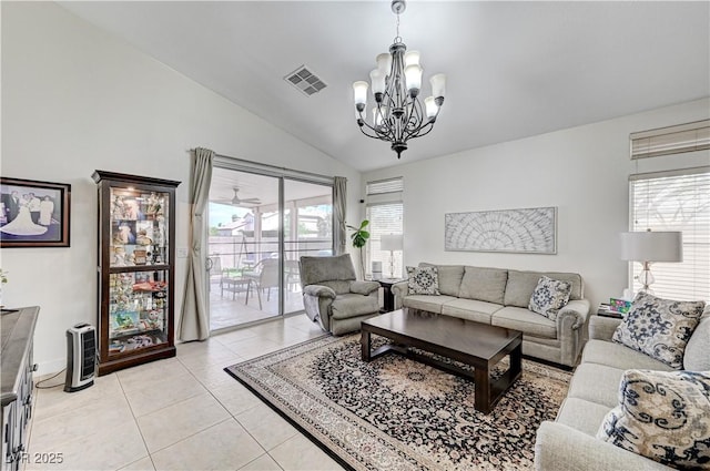 8250 Lincoln Valley St, Las Vegas, NV 89123 - living room with lofted ceiling, a chandelier, light tile patterned floors, and baseboards