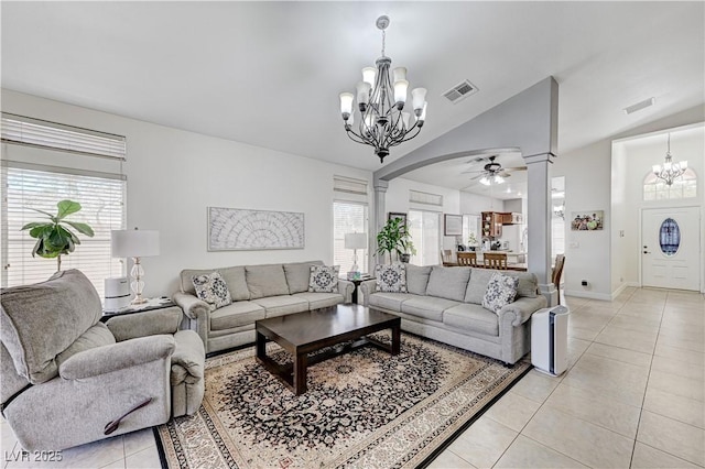 8250 Lincoln Valley St, Las Vegas, NV 89123 - living room featuring a chandelier, ornate columns, healthy amount of natural light, light tile patterned floors, and lofted ceiling