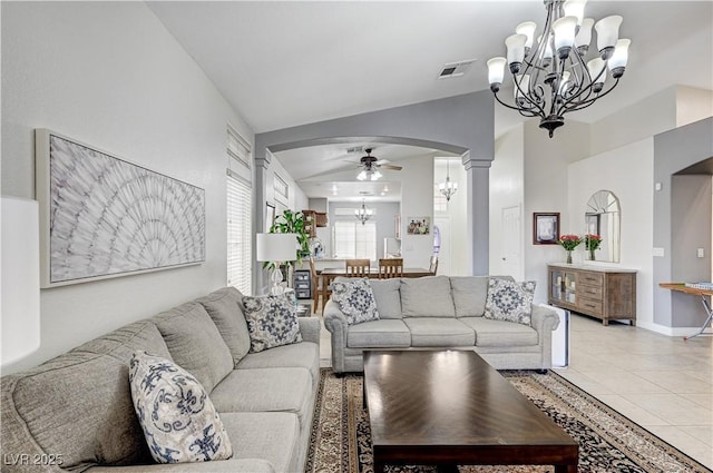 8250 Lincoln Valley St, Las Vegas, NV 89123 - living area featuring a chandelier, arched walkways, vaulted ceiling, a ceiling fan, and light tile patterned floors