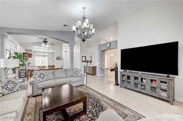 8250 Lincoln Valley St, Las Vegas, NV 89123 - living area with arched walkways, a chandelier, a ceiling fan, ornate columns, and light tile patterned floors