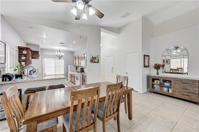 8250 Lincoln Valley St, Las Vegas, NV 89123 - dining area with a ceiling fan, a chandelier, light tile patterned floors, and high vaulted ceiling