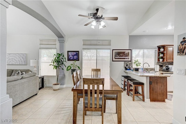 8250 Lincoln Valley St, Las Vegas, NV 89123 - dining room with a ceiling fan, arched walkways, healthy amount of natural light, and light tile patterned flooring