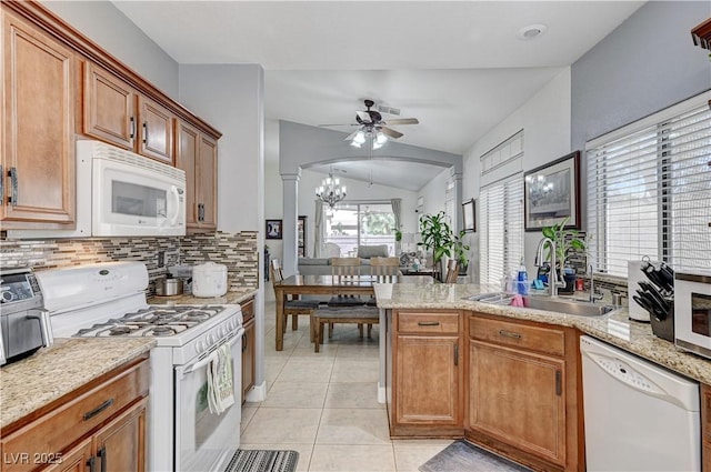 8250 Lincoln Valley St, Las Vegas, NV 89123 - kitchen featuring white appliances, a sink, a ceiling fan, tasteful backsplash, and vaulted ceiling