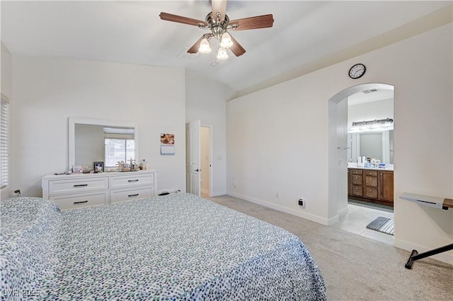 8250 Lincoln Valley St, Las Vegas, NV 89123 - bedroom with arched walkways, light colored carpet, vaulted ceiling, baseboards, and a ceiling fan