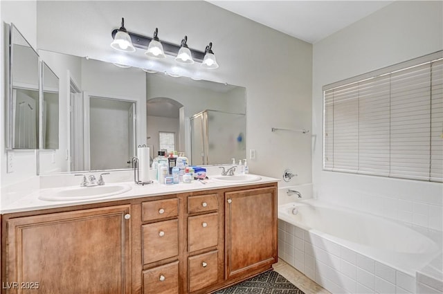 8250 Lincoln Valley St, Las Vegas, NV 89123 - bathroom featuring a shower stall, a bath, double vanity, and tile patterned floors