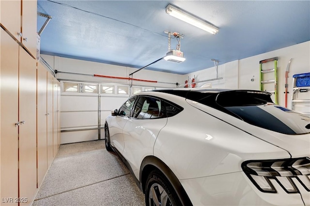 8250 Lincoln Valley St, Las Vegas, NV 89123 - garage featuring a garage door opener