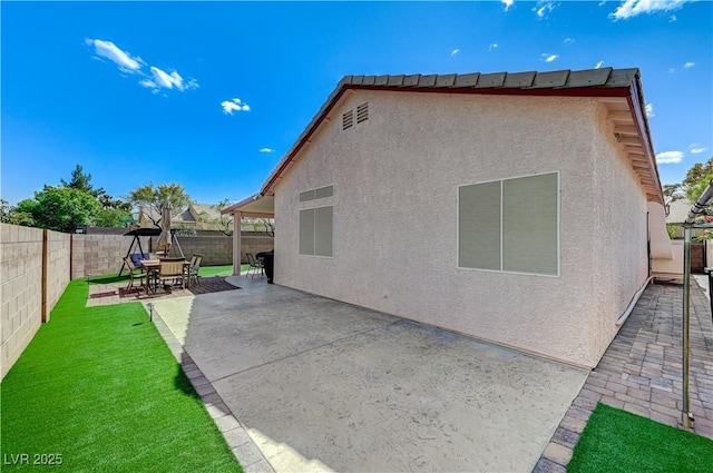 8250 Lincoln Valley St, Las Vegas, NV 89123 - back of house with a patio area and stucco siding