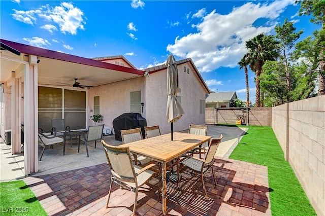 8250 Lincoln Valley St, Las Vegas, NV 89123 - view of patio / terrace with outdoor dining area, a fenced backyard, a ceiling fan, and a grill