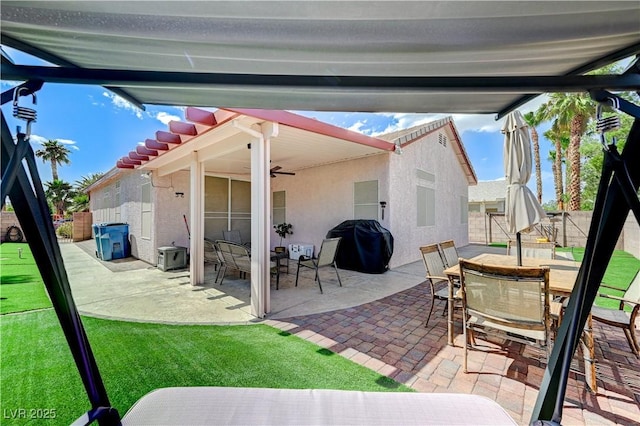 8250 Lincoln Valley St, Las Vegas, NV 89123 - view of patio featuring outdoor dining space, fence, area for grilling, and a ceiling fan