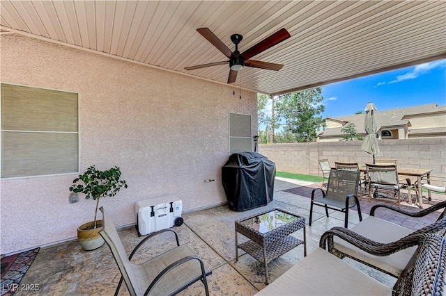 8250 Lincoln Valley St, Las Vegas, NV 89123 - view of patio with grilling area, fence, a ceiling fan, outdoor dining space, and outdoor lounge area