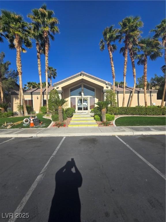 8985 S Durango Dr Unit 1154, Las Vegas, NV 89113 - view of building exterior featuring uncovered parking