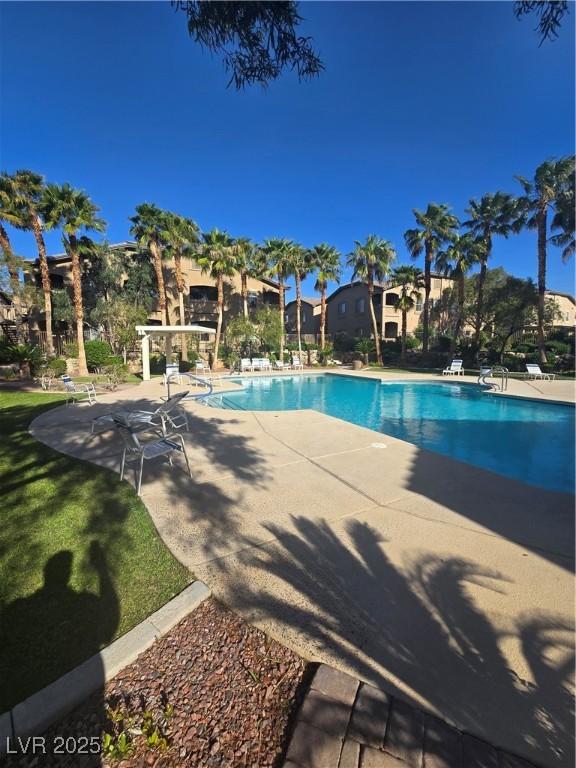 8985 S Durango Dr Unit 1154, Las Vegas, NV 89113 - community pool featuring a patio area
