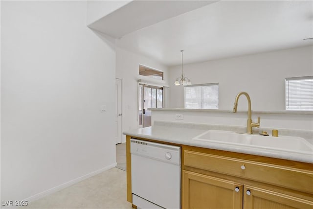 8985 S Durango Dr Unit 1154, Las Vegas, NV 89113 - kitchen with white dishwasher, a sink, light countertops, hanging light fixtures, and a chandelier