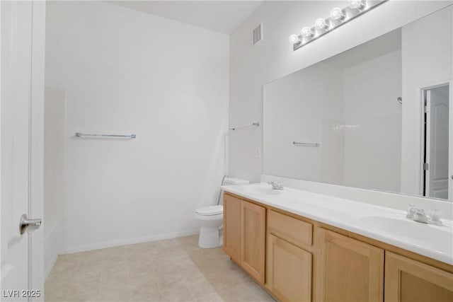 8985 S Durango Dr Unit 1154, Las Vegas, NV 89113 - full bath featuring double vanity, toilet, and baseboards