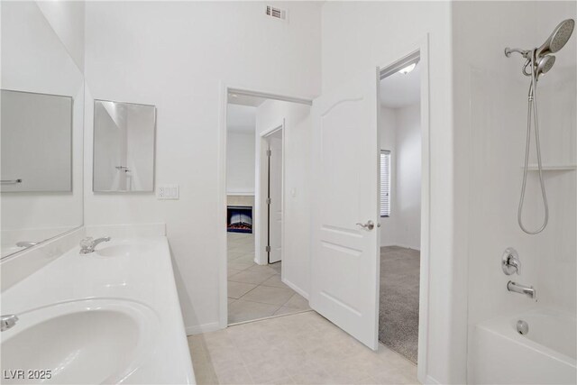 8985 S Durango Dr Unit 1154, Las Vegas, NV 89113 - full bath featuring double vanity, bathing tub / shower combination, tile patterned floors, and baseboards