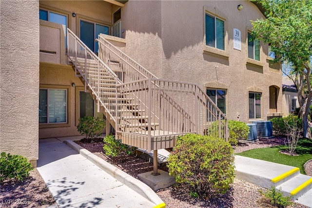 8985 S Durango Dr Unit 1154, Las Vegas, NV 89113 - view of building exterior with stairway and central AC unit