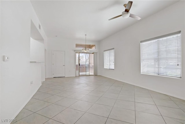 8985 S Durango Dr Unit 1154, Las Vegas, NV 89113 - spare room with a ceiling fan, light tile patterned floors, and baseboards