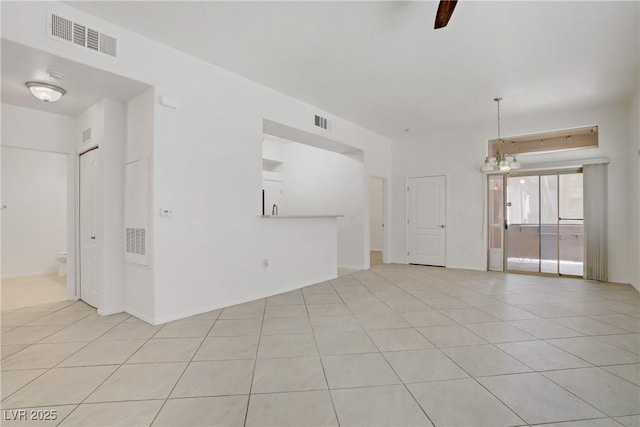 8985 S Durango Dr Unit 1154, Las Vegas, NV 89113 - unfurnished room featuring light tile patterned floors and a chandelier