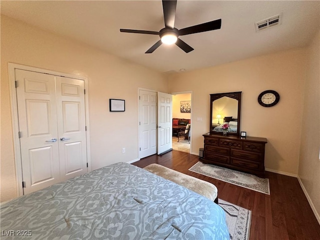 2558 Divine Sky Dr, Henderson, NV 89044 - bedroom with dark wood-style flooring, baseboards, and a ceiling fan