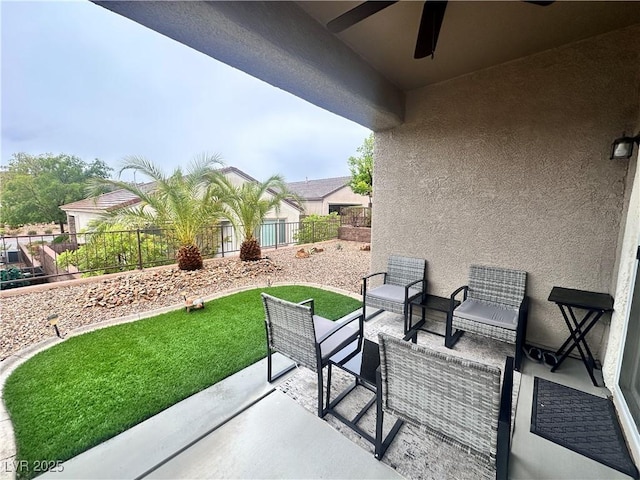 2558 Divine Sky Dr, Henderson, NV 89044 - view of patio with a fenced backyard, ceiling fan, and outdoor lounge area