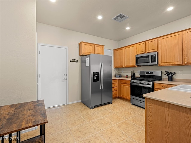 2558 Divine Sky Dr, Henderson, NV 89044 - kitchen with appliances with stainless steel finishes, light countertops, and recessed lighting