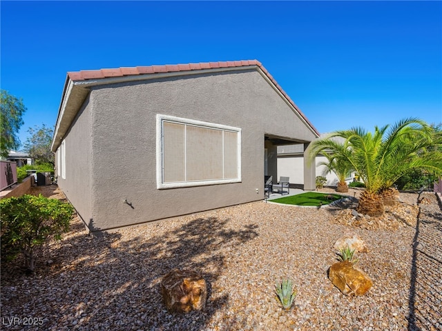 2558 Divine Sky Dr, Henderson, NV 89044 - back of house featuring a patio and stucco siding