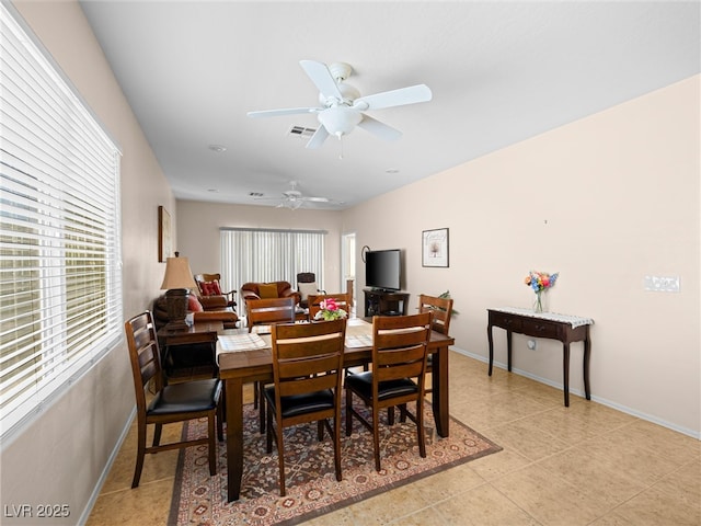 2558 Divine Sky Dr, Henderson, NV 89044 - dining room featuring light tile patterned flooring and ceiling fan