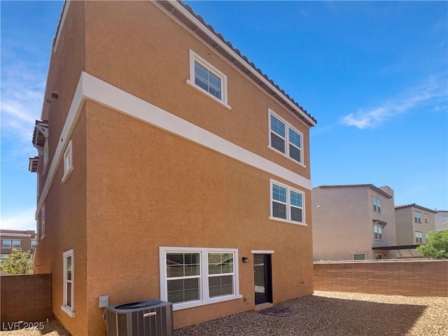 148 Campbelltown Ave, Henderson, NV 89015 - back of property with central air condition unit, stucco siding, and a fenced backyard