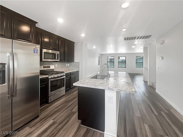 148 Campbelltown Ave, Henderson, NV 89015 - kitchen featuring appliances with stainless steel finishes, a sink, dark wood finished floors, tasteful backsplash, and recessed lighting