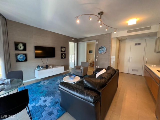 3722 Las Vegas Blvd Unit 2709, Las Vegas, NV 89158 - living room with light tile patterned floors, track lighting, and wallpapered walls