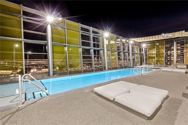 3722 Las Vegas Blvd Unit 2709, Las Vegas, NV 89158 - pool at twilight with a community pool
