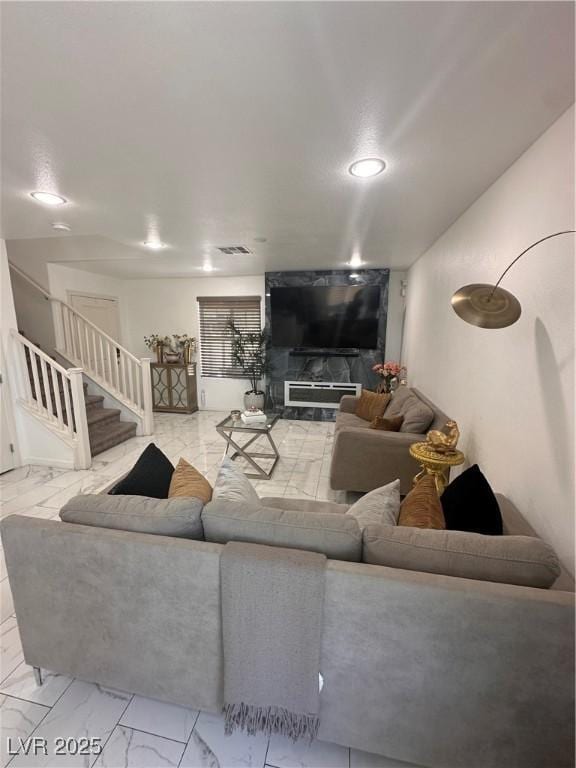 369 Stone Fly Rd, North Las Vegas, NV 89032 - living area featuring marble finish flooring, stairs, and recessed lighting