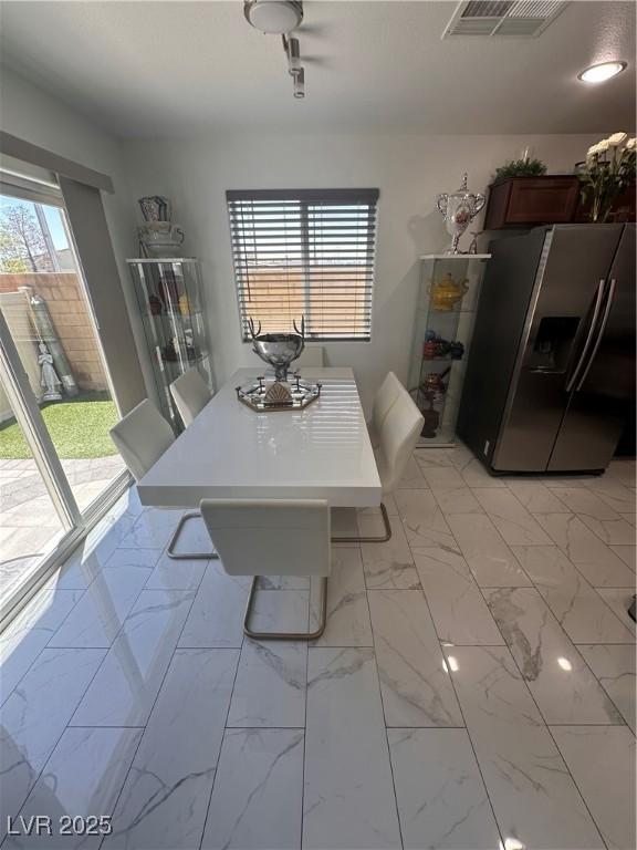 369 Stone Fly Rd, North Las Vegas, NV 89032 - dining space featuring light marble finish flooring