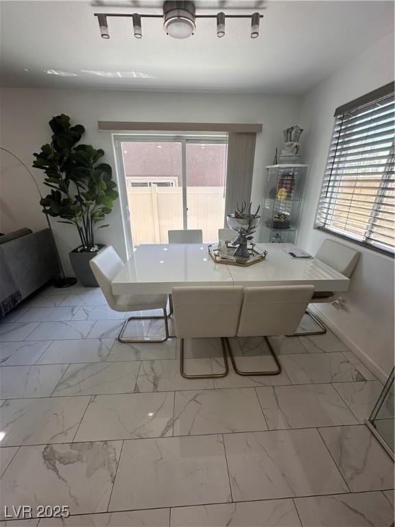 369 Stone Fly Rd, North Las Vegas, NV 89032 - dining room featuring marble look tiles and baseboards