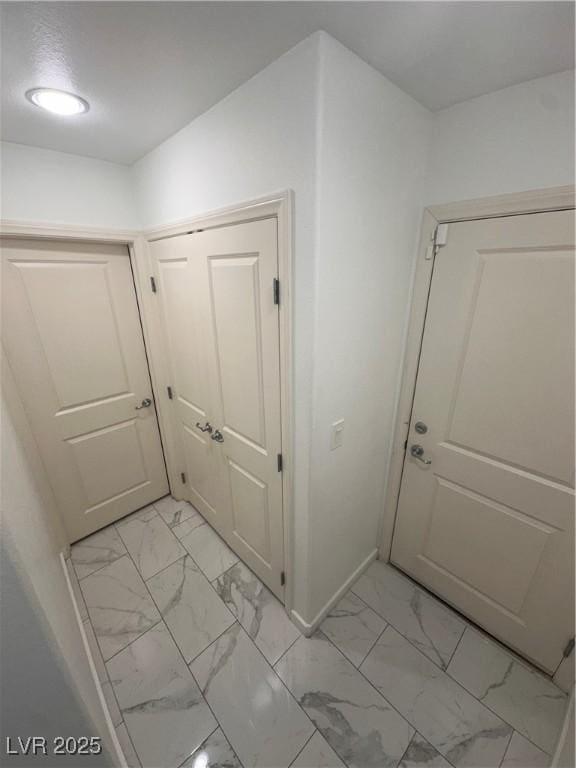 369 Stone Fly Rd, North Las Vegas, NV 89032 - hall featuring light marble finish floors and baseboards