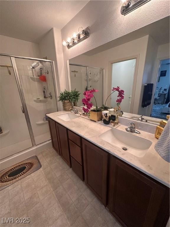 369 Stone Fly Rd, North Las Vegas, NV 89032 - bathroom with a shower stall and double vanity