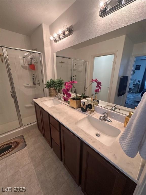 369 Stone Fly Rd, North Las Vegas, NV 89032 - bathroom featuring a stall shower and double vanity