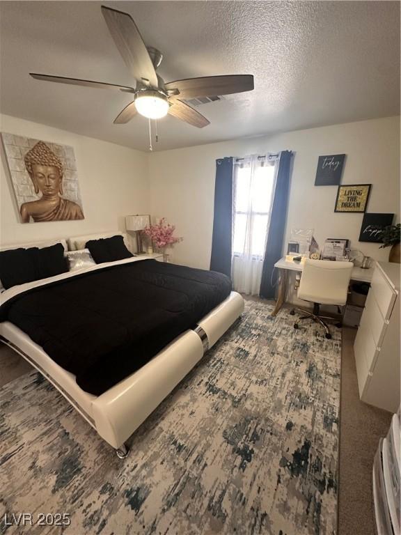 369 Stone Fly Rd, North Las Vegas, NV 89032 - bedroom featuring ceiling fan and a textured ceiling