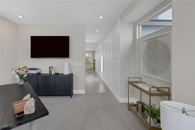 hall with plenty of natural light, carpet floors, recessed lighting, and baseboards