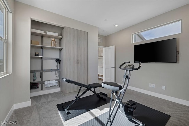 exercise area featuring carpet floors, baseboards, and recessed lighting