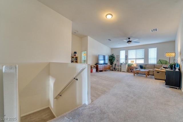 8137 Cape Flattery Ave, Las Vegas, NV 89147 - living area featuring light carpet, ceiling fan, and baseboards