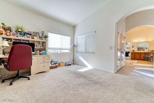 8137 Cape Flattery Ave, Las Vegas, NV 89147 - carpeted office space featuring arched walkways and vaulted ceiling