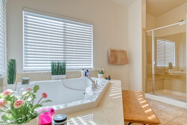 8137 Cape Flattery Ave, Las Vegas, NV 89147 - full bathroom with tile patterned flooring, a shower stall, and a bath