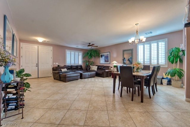 8137 Cape Flattery Ave, Las Vegas, NV 89147 - dining area featuring a chandelier, light tile patterned floors, and a ceiling fan