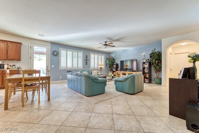 8137 Cape Flattery Ave, Las Vegas, NV 89147 - living room featuring a ceiling fan, plenty of natural light, and light tile patterned floors
